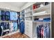 Spacious walk-in closet with custom shelving, drawers, and ample storage space for an organized wardrobe at 1208 Patterson Ter, Lake Mary, FL 32746