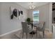 Cozy dining room with a modern light fixture and decorative artwork on the walls at 1218 Normandy Dr, Haines City, FL 33844