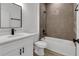 Elegant bathroom featuring a single vanity, quartz counters, and a tiled shower-tub combination for comfort at 13836 Sw 27Th Ter, Ocala, FL 34471