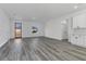 Bright living room featuring modern gray flooring and a glass door leading to the outside at 13836 Sw 27Th Ter, Ocala, FL 34471