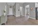 Spacious hallway featuring tile floors, stylish lighting, and access to various rooms at 1660 5 Ave, Deland, FL 32724