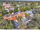 A high aerial view of a residential area with houses featuring mixed roofing and lush vegetation at 176 Balfour Dr # 4, Winter Park, FL 32792