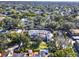 A high angle aerial view shows a well-maintained building surrounded by mature trees at 176 Balfour Dr # 4, Winter Park, FL 32792