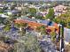 Stunning aerial view of property featuring a distinctive terra cotta roof and lush landscaping at 176 Balfour Dr # 4, Winter Park, FL 32792