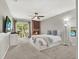 Bright bedroom featuring a fireplace, ceiling fan, and sliding glass door to a balcony at 176 Balfour Dr # 4, Winter Park, FL 32792