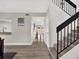 Entryway featuring a staircase with black railings and vinyl flooring at 176 Balfour Dr # 4, Winter Park, FL 32792