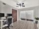 Office with wood-look floors, ceiling fan, closet and sliding glass doors at 176 Balfour Dr # 4, Winter Park, FL 32792