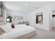 Bright bedroom with a large mirror, a decorative plant, and a comfortable bed at 1857 Columbus Path, St Cloud, FL 34771