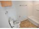 Clean and well-lit bathroom features a toilet, shower, tub, and ample storage space at 1926 Binnacle St, Kissimmee, FL 34744