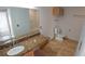 Bathroom featuring a large vanity with a granite top, a toilet, and a shower-tub combo at 1926 Binnacle St, Kissimmee, FL 34744