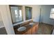 Bathroom features dual sinks with granite countertops, framed mirrors, and an open passage to the shower at 1926 Binnacle St, Kissimmee, FL 34744