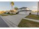 A stunning two-story home with three car garage, palm trees and well-maintained landscaping at 1926 Binnacle St, Kissimmee, FL 34744