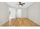 Empty bedroom with light wood flooring, neutral walls, and modern ceiling fan at 1995 Brewster Dr, Deltona, FL 32738