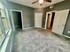 Bedroom with carpet flooring, ceiling fan and a closet for ample storage at 2000 Erving Cir # 201, Ocoee, FL 34761