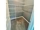 Walk-in closet with multiple levels of wire shelving and carpeting at 2000 Erving Cir # 201, Ocoee, FL 34761