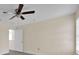 Spacious bedroom with neutral walls, ceiling fan, and laminate flooring at 2001 Claudia Ln # 2001, Kissimmee, FL 34741