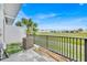 Outdoor patio with a black metal fence, lawn view, and AC unit at 2001 Claudia Ln # 2001, Kissimmee, FL 34741