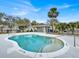 Community pool with a gazebo and metal fence at 2001 Claudia Ln # 2001, Kissimmee, FL 34741