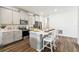 Modern kitchen with stainless steel appliances and an island with bar stool seating at 2563 Kinsale Ln, Ormond Beach, FL 32174