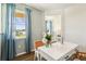 Cozy office featuring a white table and a vase with tulips. Lots of light coming in from the large window at 2567 Kinsale Ln, Ormond Beach, FL 32174