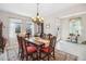 Traditional dining room featuring a wooden table and ample natural light at 2606 Pinyonpine Ln, Sanford, FL 32773