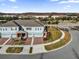 Beautiful aerial view of townhome featuring brick driveway and walkway, manicured lawn, and gated community at 2788 Pleasant Cypress Cir, Kissimmee, FL 34741