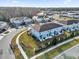 Drone shot showing lush landscaping, manicured lawns, and gated entry of desirable townhome community at 2788 Pleasant Cypress Cir, Kissimmee, FL 34741