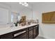 Bathroom vanity features a white countertop and elegant decor at 2788 Pleasant Cypress Cir, Kissimmee, FL 34741