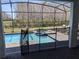 Screened-in pool and spa area, with a protective safety fence at 2800 Simile St, Kissimmee, FL 34746