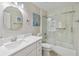 Bathroom featuring a vanity with drawers, a large mirror, and a tiled shower-tub combo at 2929 University Acres Dr, Orlando, FL 32817