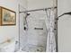 Bathroom featuring a tiled shower with pebble floor and a decorative shower curtain at 2929 University Acres Dr, Orlando, FL 32817