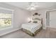 Comfortable bedroom featuring a window with natural light and a view of the outdoors at 2929 University Acres Dr, Orlando, FL 32817