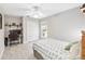 Simple bedroom with a work desk, chair, and double door closet at 2929 University Acres Dr, Orlando, FL 32817