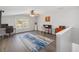 Bonus room with wood floors, a ceiling fan, and natural light creating a cozy atmosphere at 2929 University Acres Dr, Orlando, FL 32817