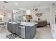 Open kitchen featuring an island with a sink and stainless dishwasher, flowing into the living space at 2929 University Acres Dr, Orlando, FL 32817