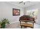 Living room featuring a piano, a painting, natural light, and neutral color palette at 2929 University Acres Dr, Orlando, FL 32817