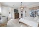 This is a light and airy main bedroom with modern flooring and a view of the pool deck through sliding doors at 2929 University Acres Dr, Orlando, FL 32817