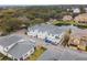 Aerial view of townhome community, featuring mature trees and landscaping at 2956 Oak Park Way # 45, Orlando, FL 32822