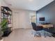 Minimalist-style room with desk, shelving, and natural light. Great for home office or guest space at 2956 Oak Park Way # 45, Orlando, FL 32822