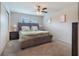 Cozy bedroom with a queen-sized bed, neutral decor, and a ceiling fan for added comfort at 2956 Oak Park Way # 45, Orlando, FL 32822