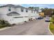 Charming townhome exteriors featuring attached garages and manicured landscaping along a well-maintained street at 2956 Oak Park Way # 45, Orlando, FL 32822