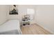 Cozy bedroom with natural light, featuring a simple bed and storage solutions at 2976 Saint George St, Orlando, FL 32814