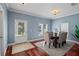 Dining room with modern chandelier, neutral walls, and hardwood floors at 2976 Saint George St, Orlando, FL 32814