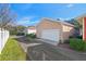 Exterior shot of the driveway showing a well-manicured lawn and a garage at 2976 Saint George St, Orlando, FL 32814