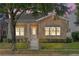 Charming one-story home with beige wood plank siding and a well-manicured lawn at 2976 Saint George St, Orlando, FL 32814