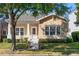 Charming one-story home with beige wood plank siding and a well-manicured lawn at 2976 Saint George St, Orlando, FL 32814