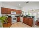 Well-lit kitchen area has wood cabinets and stainless steel appliances, providing a functional cooking space at 2976 Saint George St, Orlando, FL 32814