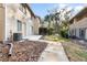 Townhome backyard with patio space and tropical foliage at 311 Sandlewood Trl # 4, Winter Park, FL 32789