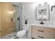 Bathroom featuring a glass shower with black hardware and modern vanity with a flower pot at 311 Sandlewood Trl # 4, Winter Park, FL 32789