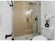 Modern shower features a glass door with black hardware and sleek design at 311 Sandlewood Trl # 4, Winter Park, FL 32789